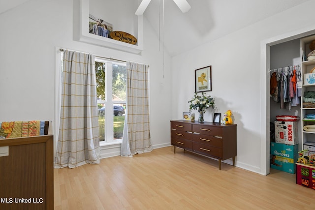 foyer entrance with ceiling fan, high vaulted ceiling, and light hardwood / wood-style flooring