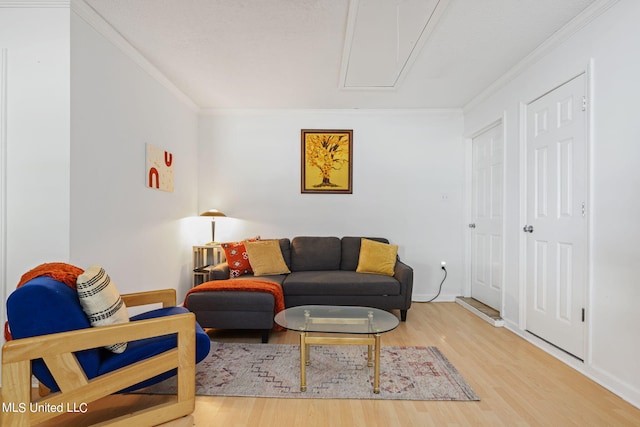 living room featuring crown molding and wood-type flooring