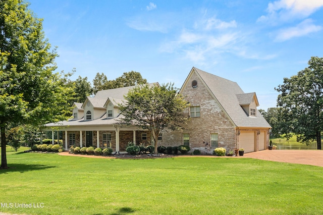 445 Carey Chapel Rd, Red Banks, MS 38661 - view of front facade featuring a garage, concrete driveway, a front yard, and brick siding