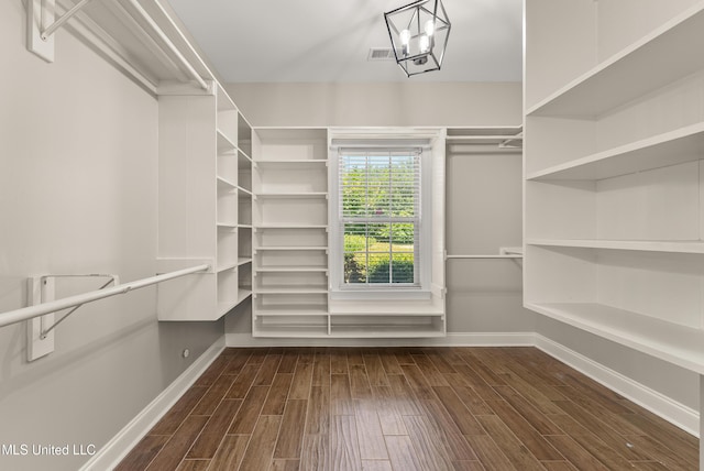 445 Carey Chapel Rd, Red Banks, MS 38661 - walk in closet with dark wood-style floors and a chandelier