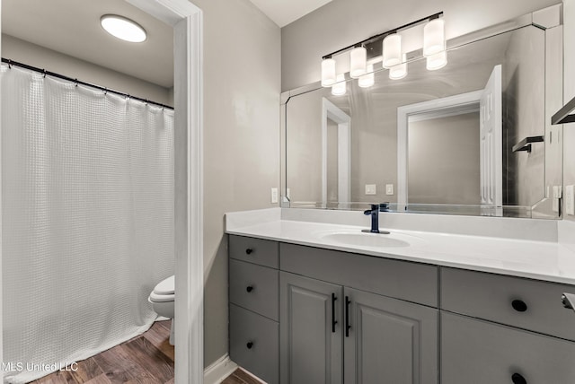 445 Carey Chapel Rd, Red Banks, MS 38661 - full bathroom featuring vanity, wood finished floors, and a shower with curtain