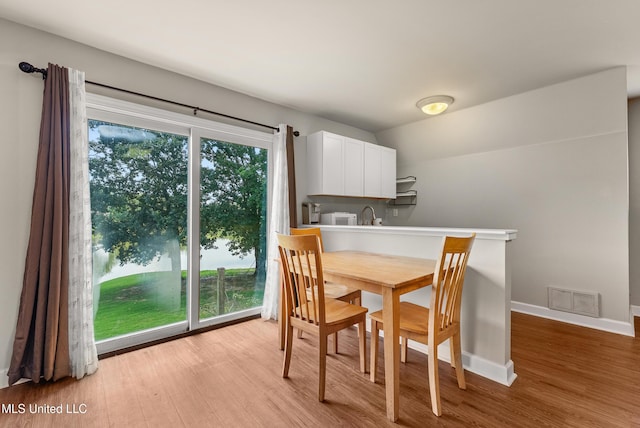 445 Carey Chapel Rd, Red Banks, MS 38661 - dining room featuring light wood-style floors and baseboards
