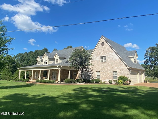 445 Carey Chapel Rd, Red Banks, MS 38661 - cape cod house featuring a front yard, a porch, driveway, and stone siding