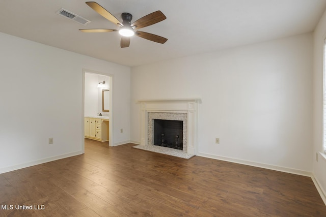 121 Kenbridge Ln, Madison, MS 39110 - unfurnished living room with visible vents, a brick fireplace, wood finished floors, baseboards, and ceiling fan