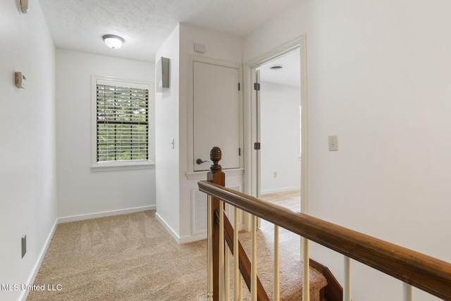 121 Kenbridge Ln, Madison, MS 39110 - hallway with baseboards, visible vents, light carpet, and an upstairs landing