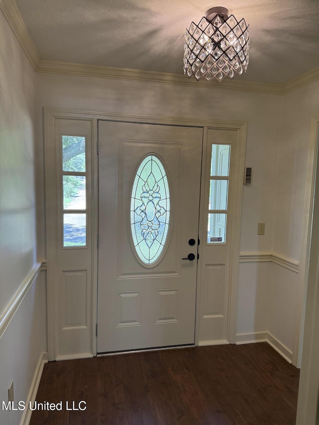 121 Kenbridge Ln, Madison, MS 39110 - entryway with crown molding, a textured ceiling, dark wood-style flooring, and baseboards