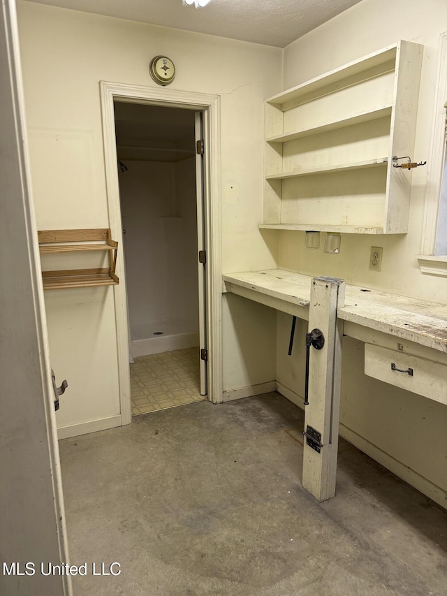 121 Kenbridge Ln, Madison, MS 39110 - unfurnished office with concrete flooring and built in desk