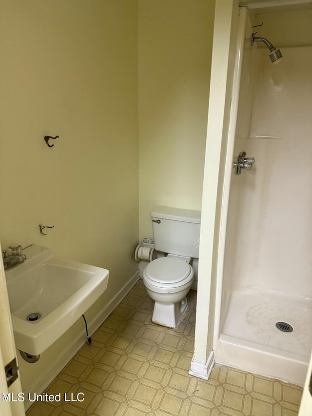 121 Kenbridge Ln, Madison, MS 39110 - full bathroom featuring toilet, tile patterned floors, a sink, and a stall shower