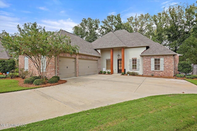 view of front of property with concrete driveway, brick siding, an attached garage, and a shingled roof