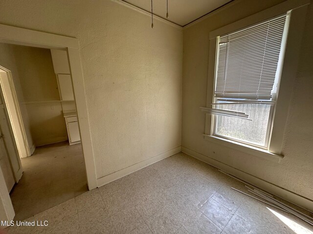 315 S Bolivar Ave, Cleveland, MS 38732 - empty room with light flooring, baseboards, and a textured wall