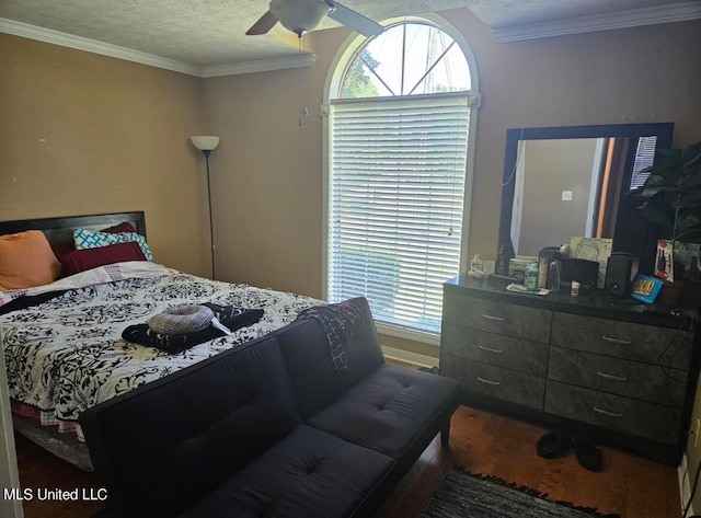 bedroom with crown molding, a textured ceiling, hardwood / wood-style flooring, and ceiling fan