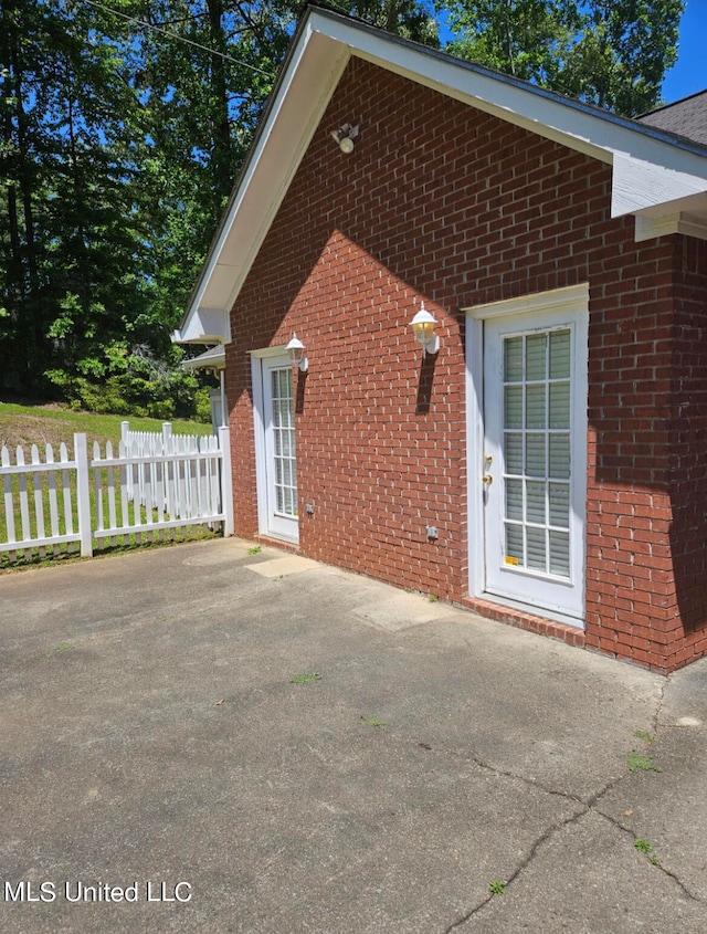 view of property exterior featuring a patio