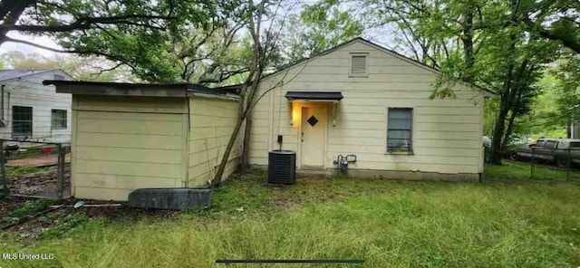 back of property with cooling unit