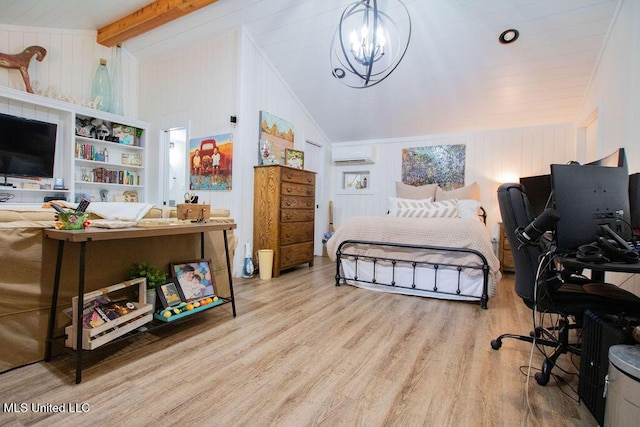 65 Vaiden Dr, Hernando, MS 38632 - bedroom featuring a chandelier, wood finished floors, wood walls, and a wall mounted air conditioner