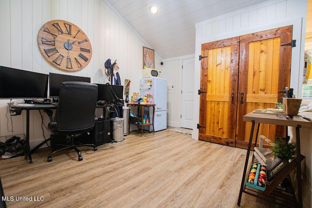 65 Vaiden Dr, Hernando, MS 38632 - home office featuring wood finished floors, wood walls, and vaulted ceiling