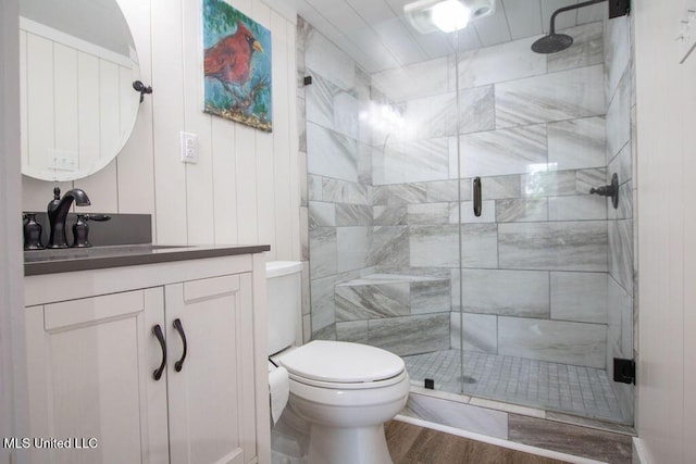 65 Vaiden Dr, Hernando, MS 38632 - full bath featuring a shower stall, toilet, vanity, and wood finished floors