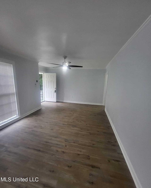 unfurnished room with ceiling fan and dark hardwood / wood-style floors