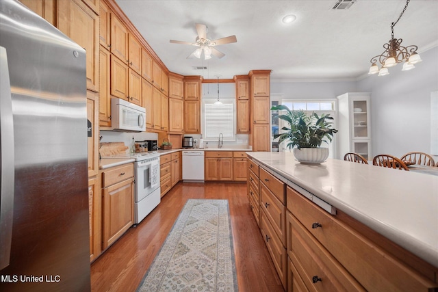 25 Savannah Cir, Brandon, MS 39047 - kitchen with white appliances, ornamental molding, decorative light fixtures, light countertops, and a ceiling fan