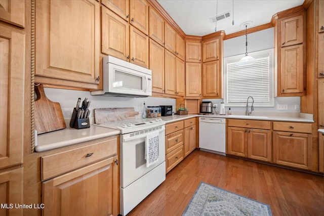 25 Savannah Cir, Brandon, MS 39047 - kitchen with white appliances, a sink, wood finished floors, and light countertops