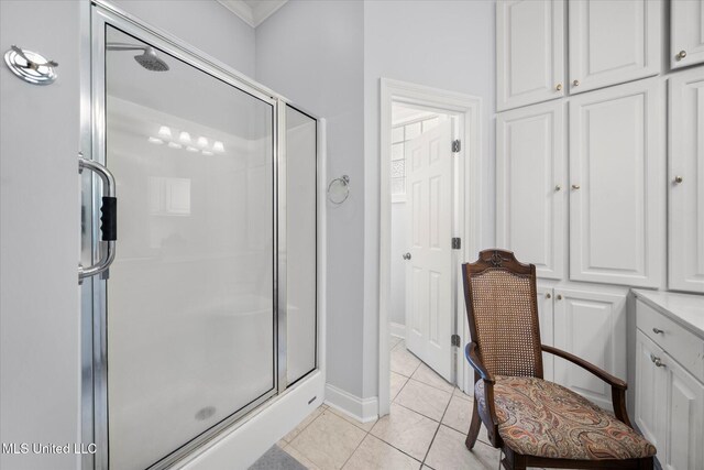 25 Savannah Cir, Brandon, MS 39047 - bathroom featuring a shower stall, tile patterned floors, baseboards, and crown molding