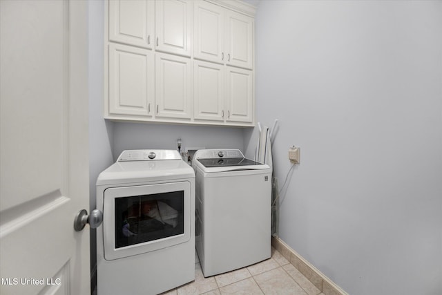 25 Savannah Cir, Brandon, MS 39047 - laundry area featuring cabinet space, independent washer and dryer, light tile patterned floors, and baseboards