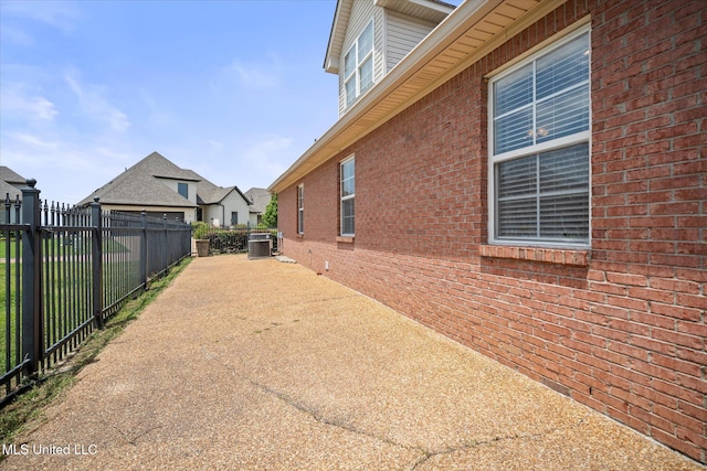 25 Savannah Cir, Brandon, MS 39047 - view of property exterior with brick siding, fence, and central AC unit