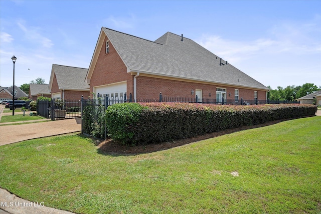 25 Savannah Cir, Brandon, MS 39047 - view of side of home featuring brick siding, a shingled roof, an attached garage, and driveway
