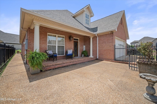 25 Savannah Cir, Brandon, MS 39047 - rear view of property featuring brick siding, a shingled roof, a porch, an attached garage, and fence