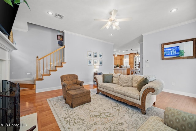 25 Savannah Cir, Brandon, MS 39047 - living room with a ceiling fan, crown molding, wood finished floors, stairs, and baseboards