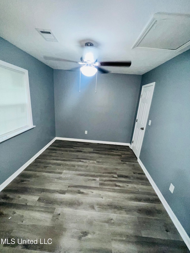 unfurnished room featuring ceiling fan and dark hardwood / wood-style flooring