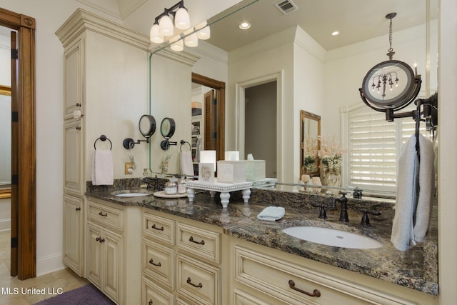 bathroom featuring recessed lighting, visible vents, a sink, and double vanity