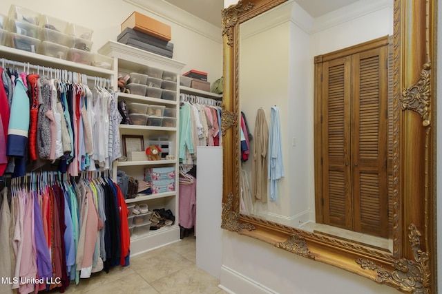 walk in closet featuring light tile patterned flooring