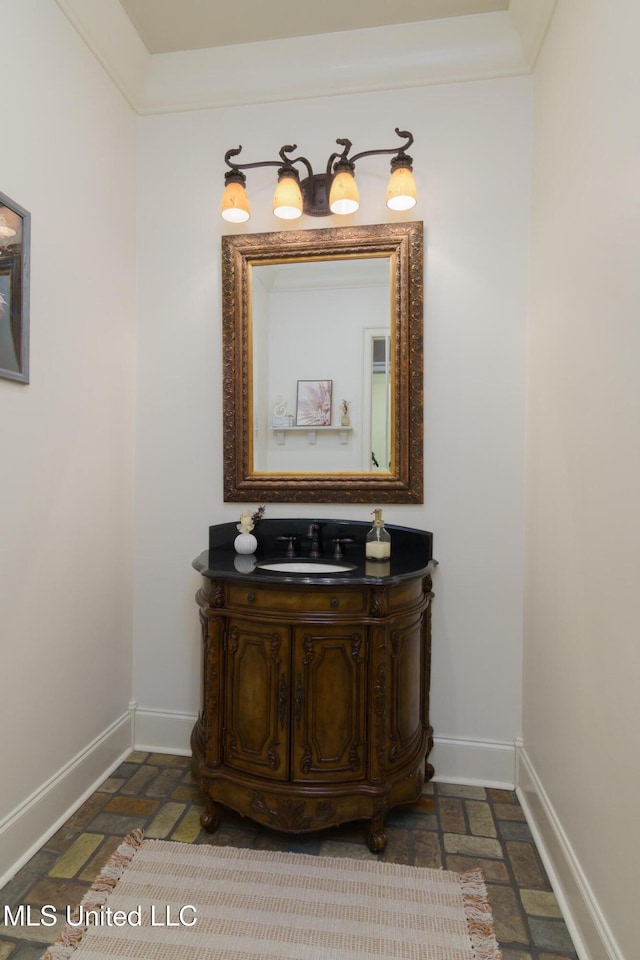 bathroom featuring baseboards and vanity