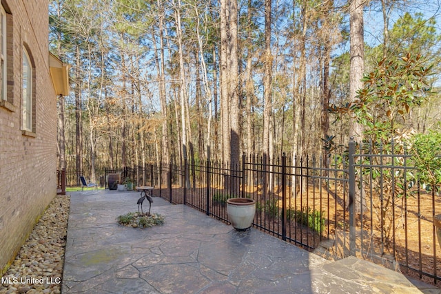 view of patio featuring fence