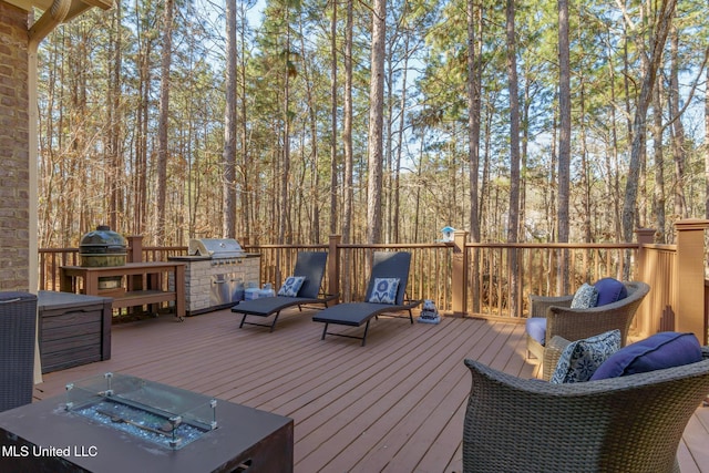 deck with a fire pit and grilling area