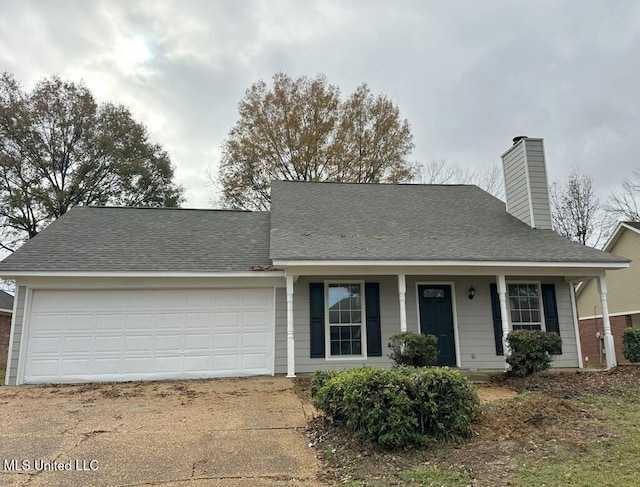 view of front of home with covered porch and a garage