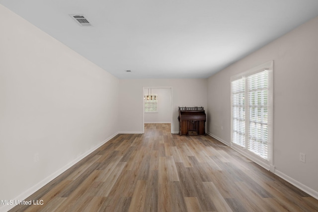 unfurnished room featuring light wood-type flooring