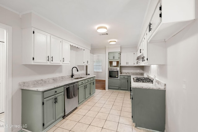 kitchen featuring ornamental molding, sink, light tile patterned flooring, and stainless steel appliances