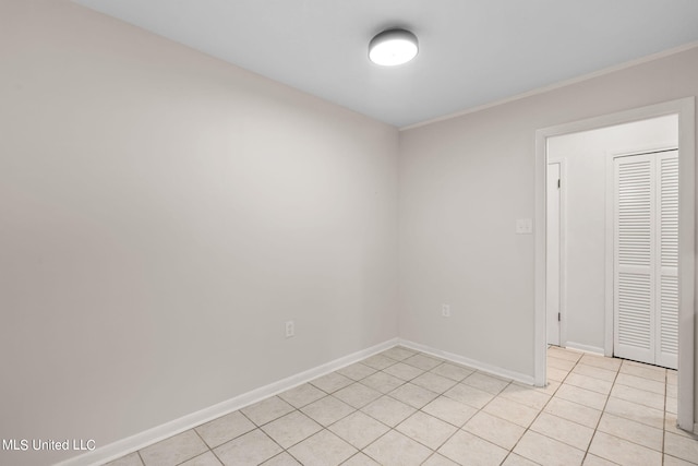 spare room with light tile patterned floors