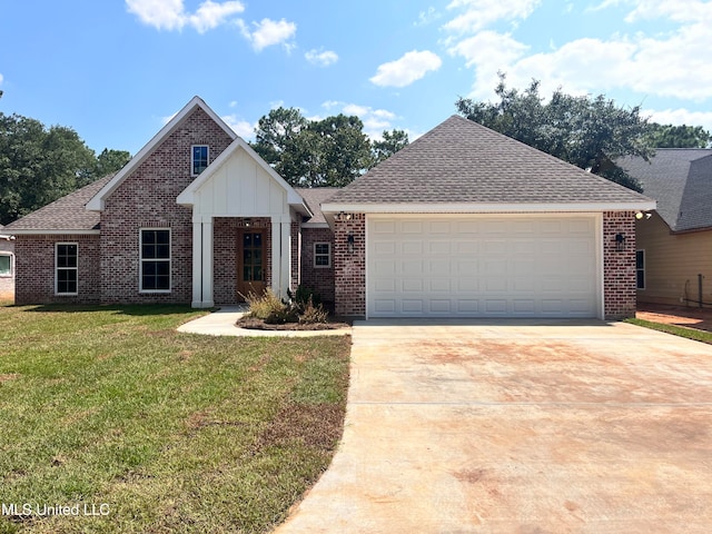 view of front of home with a front yard and a garage