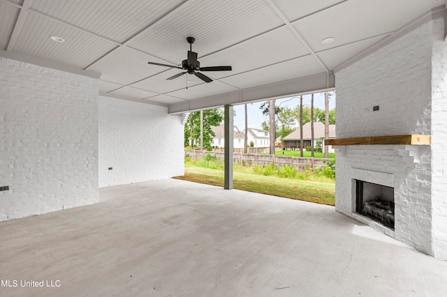 view of patio / terrace featuring an outdoor brick fireplace and ceiling fan