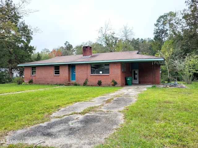 ranch-style home with a front yard and a carport