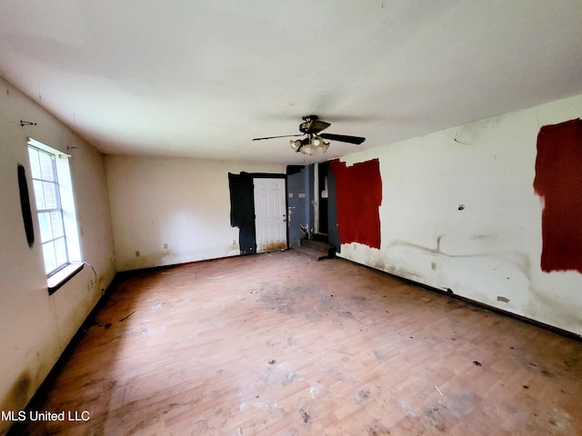 818 Cedar Grove Ave, Picayune, MS 39466 - empty room with wood finished floors, a ceiling fan, and baseboards