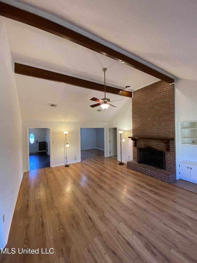790 Ewa Pl, Diamondhead, MS 39525 - unfurnished living room with a fireplace, wood finished floors, and ceiling fan
