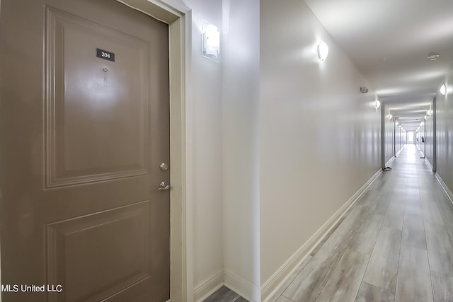 corridor featuring light hardwood / wood-style floors