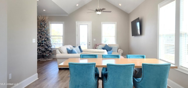 dining room featuring lofted ceiling, ceiling fan, recessed lighting, wood finished floors, and baseboards