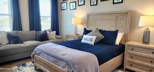 bedroom featuring multiple windows