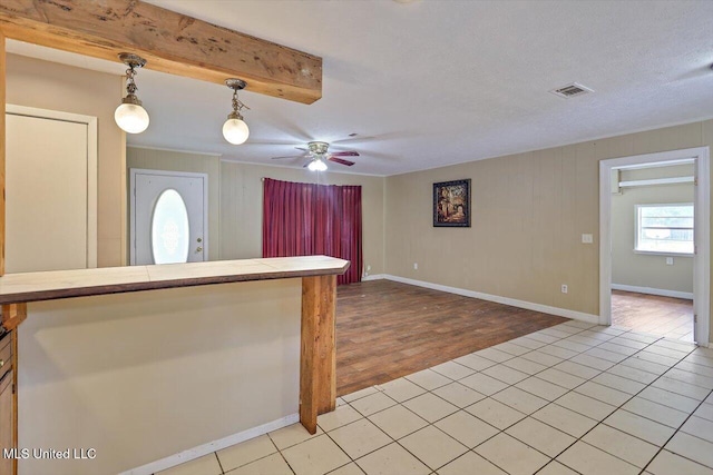 428 Simpson Cir, Mendenhall, MS 39114 - kitchen featuring decorative light fixtures, light tile patterned floors, a ceiling fan, open floor plan, and tile countertops