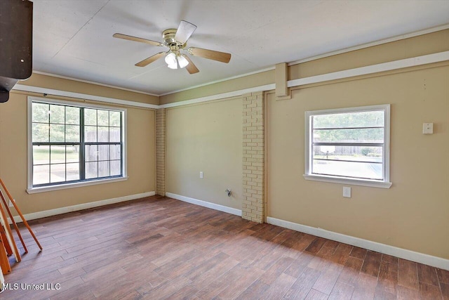 428 Simpson Cir, Mendenhall, MS 39114 - empty room featuring a ceiling fan, wood finished floors, and baseboards