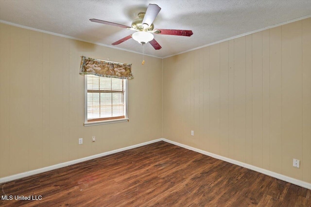 428 Simpson Cir, Mendenhall, MS 39114 - spare room with dark wood-type flooring, a ceiling fan, a textured ceiling, crown molding, and baseboards